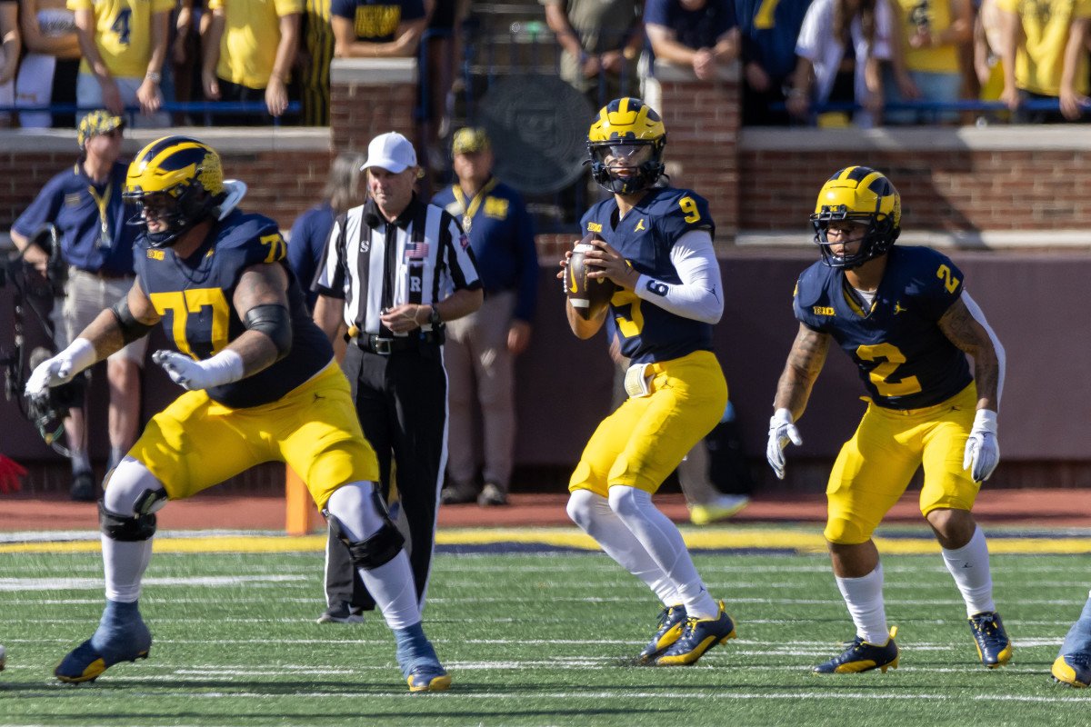 Sep 9, 2023; Ann Arbor, Michigan, USA; Michigan Wolverines quarterback J.J. McCarthy (9) looks down field against the UNLV Rebels during the first half at Michigan Stadium. Mandatory Credit: David Reginek-USA TODAY Sports